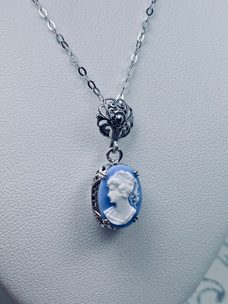 Blue & White Portrait Cameo pendant necklace, with an oval soft blue background & White Lady silhouette style cameo set in floral sterling silver filigree, 4 prongs hold the cameo in place, Silver Embrace Jewelry, Edward P70, Vintage Edwardian Jewelry