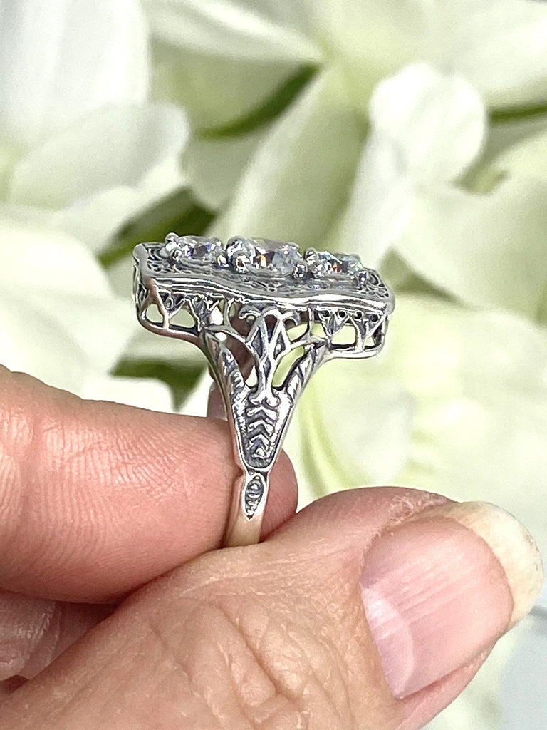 a close up of a person holding a ring, White CZ Ring, 3 round gems set in a rectangle design, Vintage style sterling silver filigree, D60 Three stone rectangle, Trinity ring