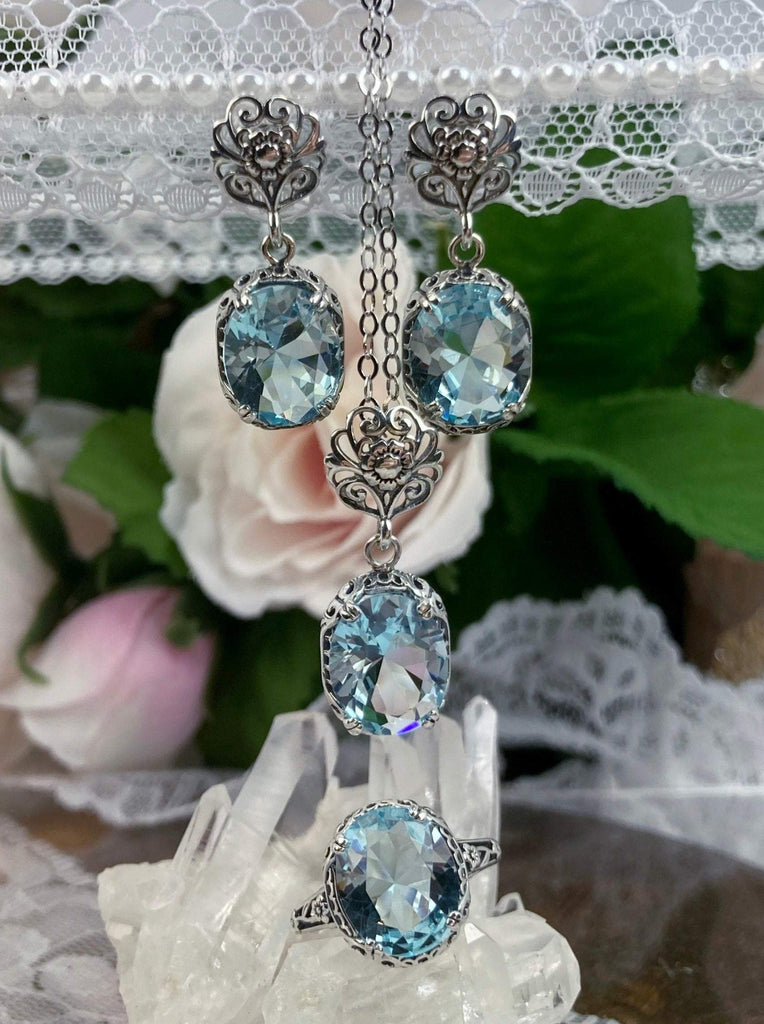 Sky Blue Aquamarine Jewelry Set, Sky Blue oval stones, Floral post earrings, matching pendant with sterling silver chain and floral bail, and vintage style sterling silver ring with floral filigree, Edward design #D70z