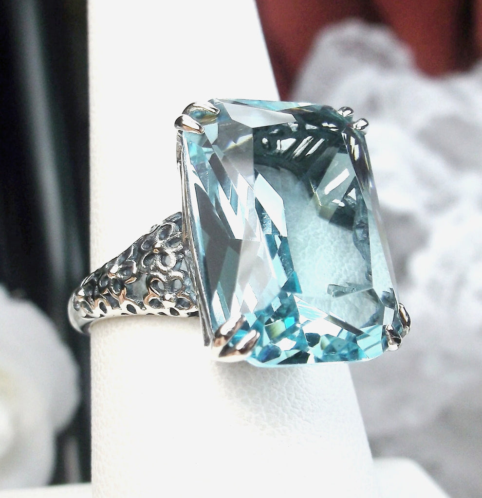 a ring with a blue topaz surrounded by white flowers, Aquamarine ring, Sky Blue Gemstone, cushion Cut, rectangle gemstone, Floral Vintage Sterling silver Filigree, Silver Embrace Jewelry, D224