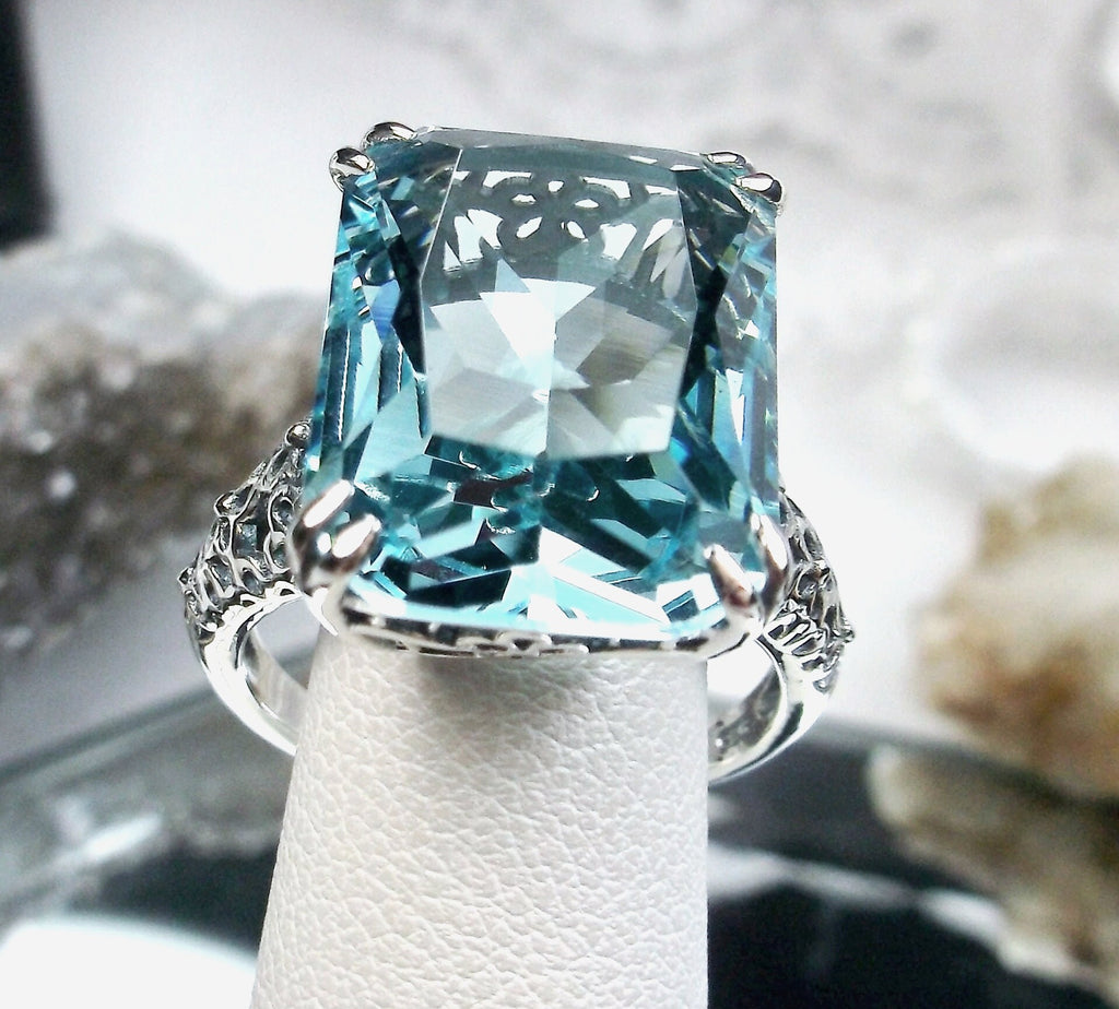 a fancy ring with a blue topaz surrounded by flowers, Aquamarine ring, Sky Blue Gemstone, cushion Cut, rectangle gemstone, Floral Vintage Sterling silver Filigree, Silver Embrace Jewelry, D224