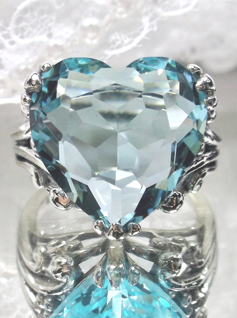 sky blue aquamarine ring with a heart shaped gem and gothic style sterling silver filigree
