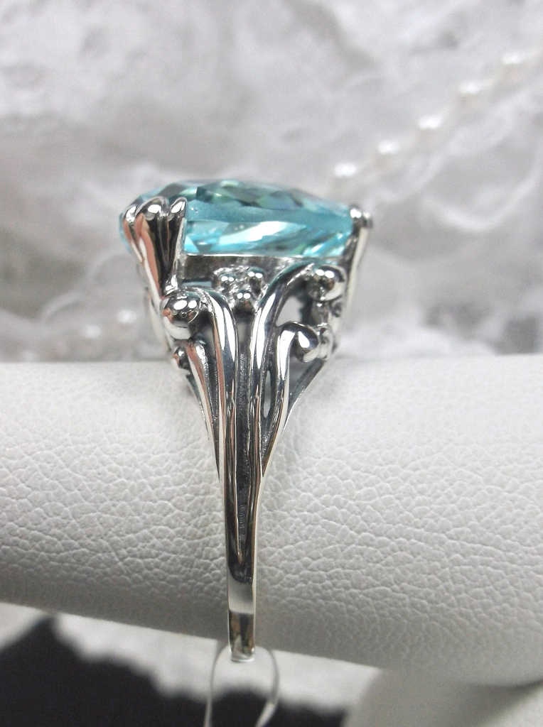 sky blue aquamarine ring with a heart shaped gem and gothic style sterling silver filigree