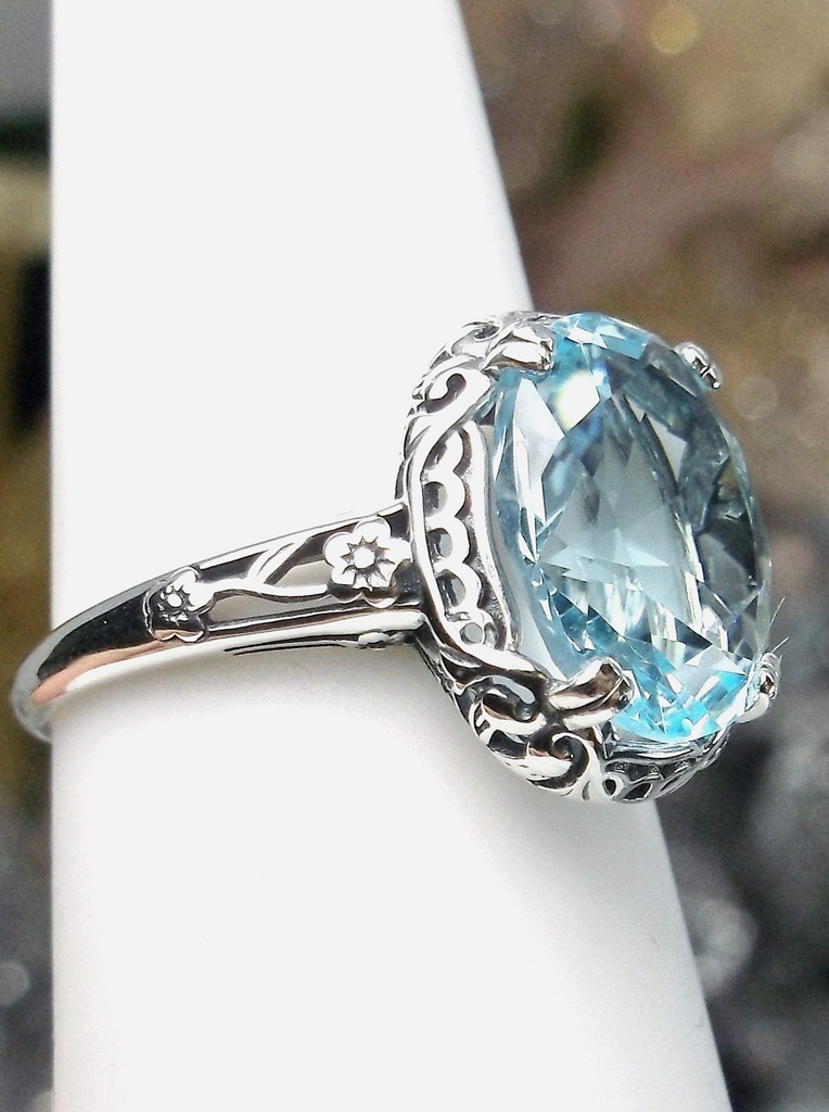 Aquamarine Ring, Sky Blue simulated oval gemstone, Sterling Silver floral filigree, Edward design #D70z, offset view on ring form