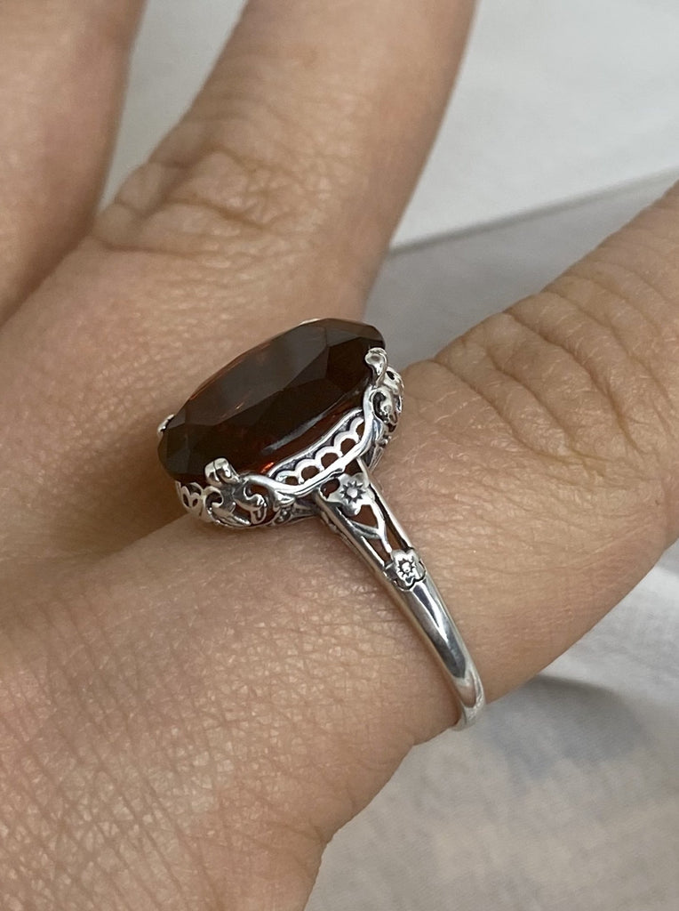 Simulated Red Garnet Ring, Sterling Silver floral filigree, Edward Design #D70, side view on a finger