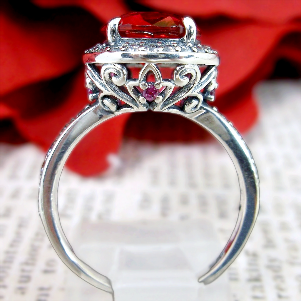 Ring with Red Ruby center gem surrounded by white CZ tiny gems, with white CZ gems down the shank, Ruby Halo Ring, White CZ Accent gems, Art Deco Sterling Silver Filigree, Halo Ring D228 | Silver Embrace Jewelry