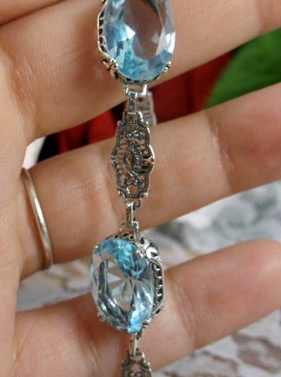 blue aquamarine bracelet with oval stones and sterling silver antique floral filigree