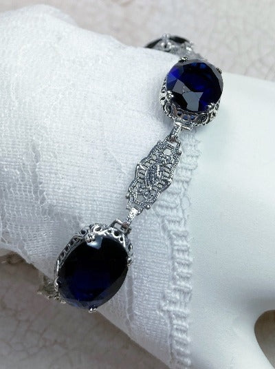 blue sapphire bracelet with oval stones and sterling silver antique floral filigree