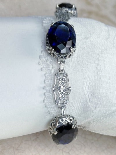 blue sapphire bracelet with oval stones and sterling silver antique floral filigree