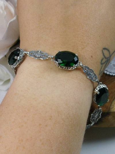 emerald green bracelet with oval stones and sterling silver antique floral filigree