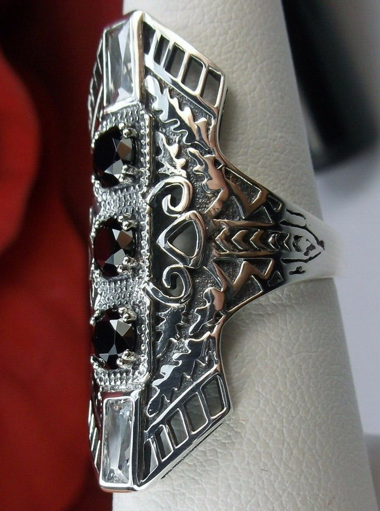 Black CZ Art Deco Ring, with three round stones and two baguette stones, intricate 1930s filigree adorns the ring and the band