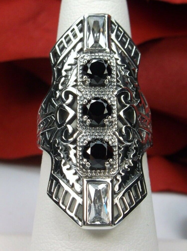 Black CZ Art Deco Ring, with three round stones and two baguette stones, intricate 1930s filigree adorns the ring and the band