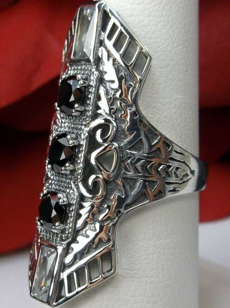 Black CZ Art Deco Ring, with three round stones and two baguette stones, intricate 1930s filigree adorns the ring and the band