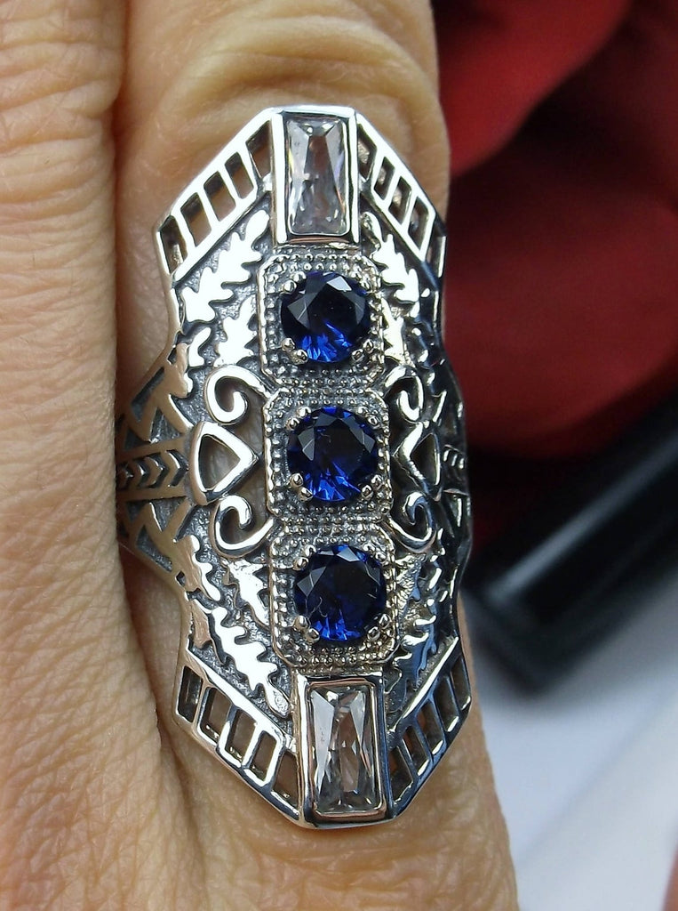Blue Sapphire Art Deco Ring, with three round stones and two baguette stones, intricate 1930s filigree adorns the ring and the band