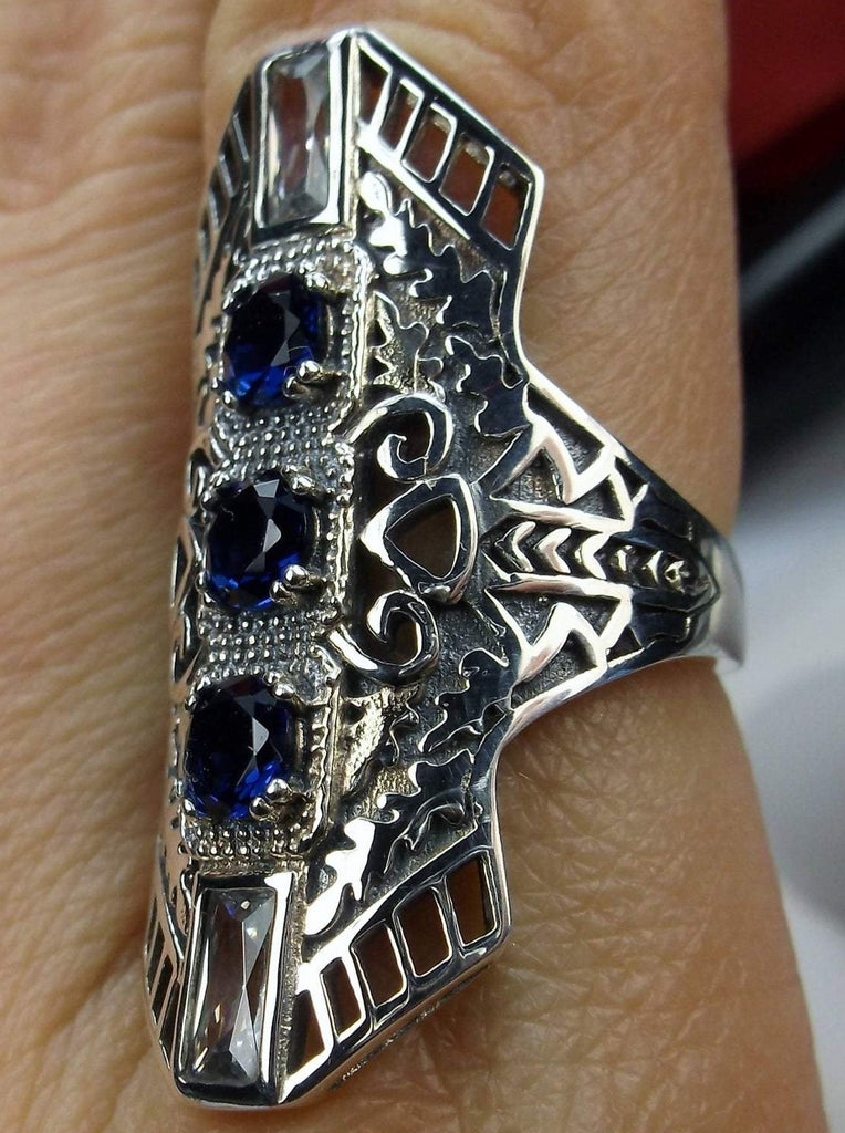 Blue Sapphire Art Deco Ring, with three round stones and two baguette stones, intricate 1930s filigree adorns the ring and the band