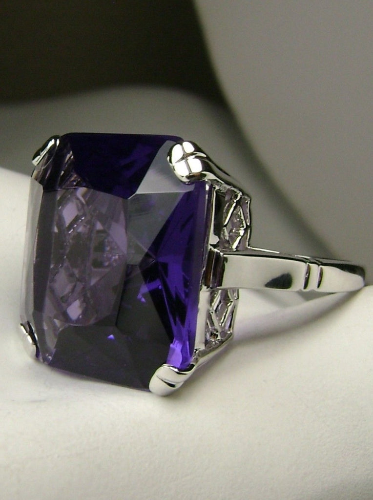 side view of  large square purple amethyst gem in crisscross basket-weave filigree art deco styled ring