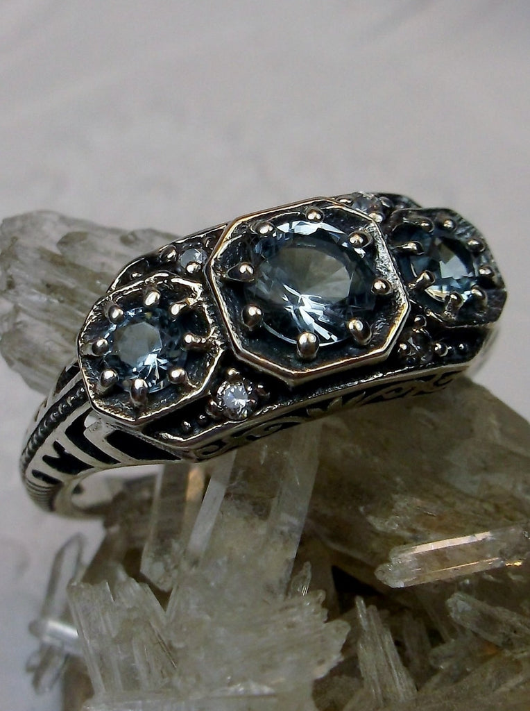 Art deco style ring with three sky blue aquamarine gems set in sterling silver filigree