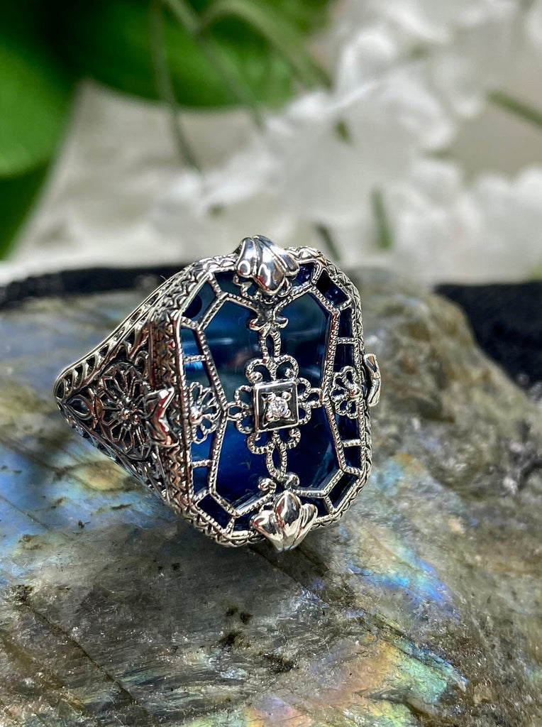 Sapphire Blue Camphor Glass Ring with Sterling Silver Art Deco Filigree and a single white CZ in the center of the pane sections