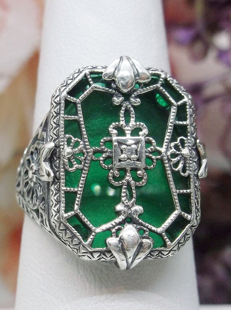 Emerald Green Camphor Glass Ring with Sterling Silver Art Deco Filigree and a single white CZ in the center of the pane sections