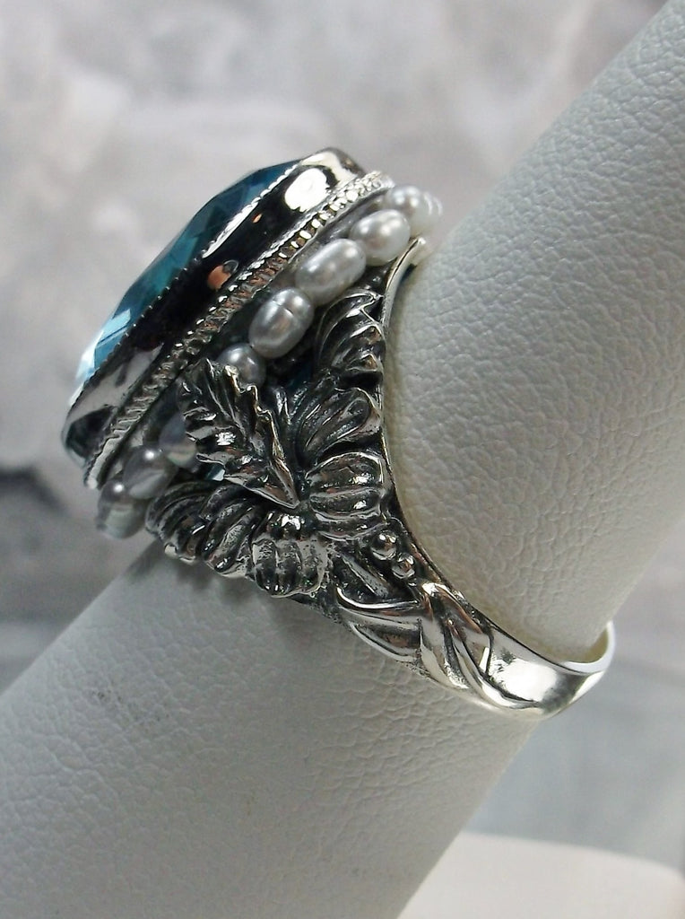 Aquamarine Blue Art Nouveau style sterling silver ring, oval sky blue gem with seed pearls encircling the gem edge and palm tree silver filigree accents on each side of the band