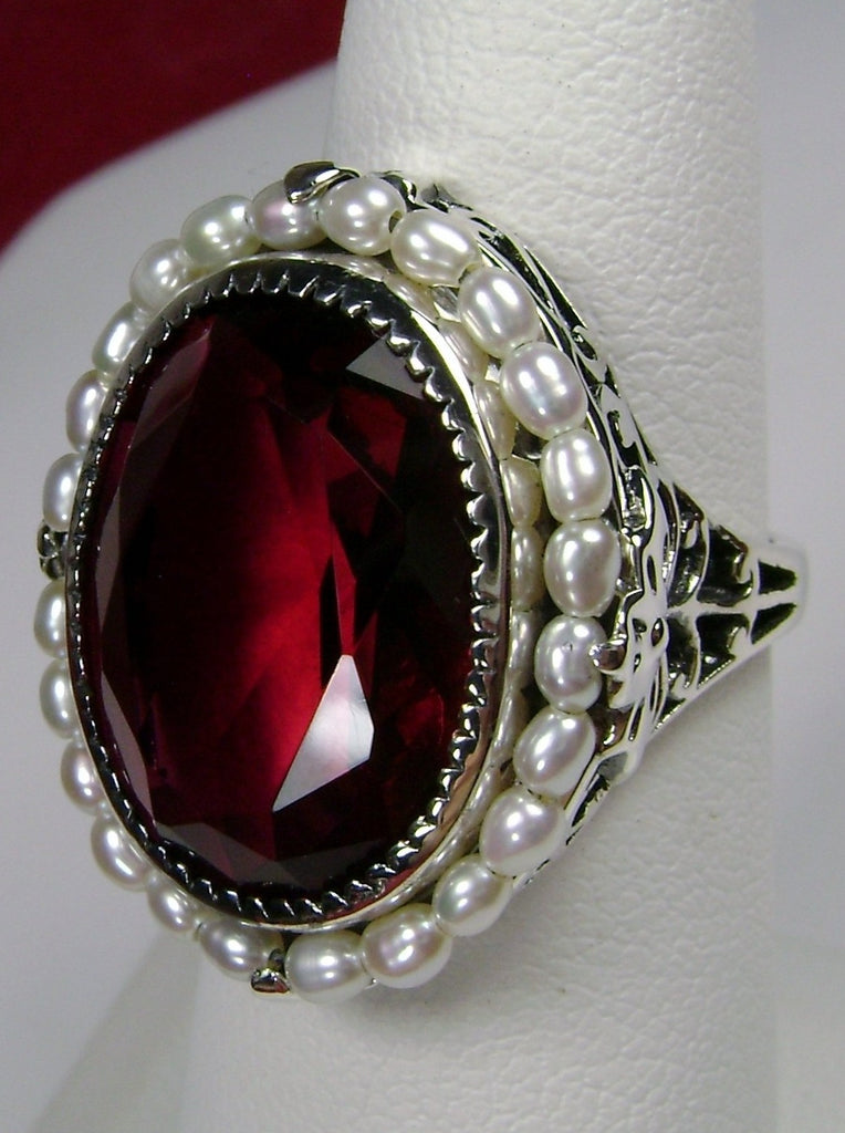 Ruby Ring, Seed Pearls surround and accent the simulated oval stone with sterling silver Victorian filigree