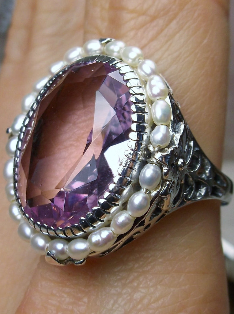 Pink Topaz Ring, Seed Pearls surround and accent the simulated oval stone with sterling silver Victorian filigree