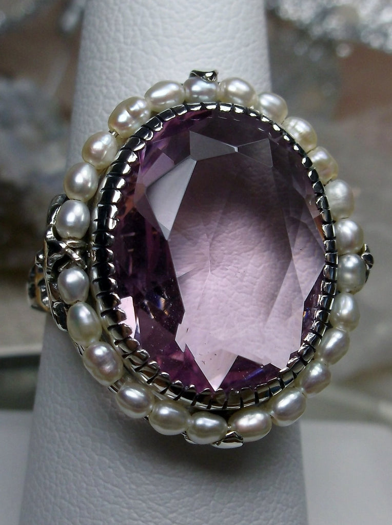 Pink Topaz Ring, Seed Pearls surround and accent the simulated oval stone with sterling silver Victorian filigree