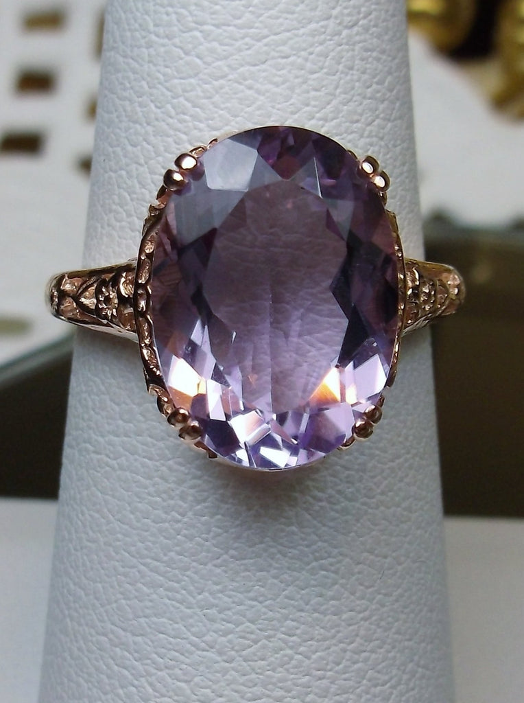 Top view of a Natural Purple Amethyst Rose Gold plated Sterling Silver Filigree Ring, Edward Design#70 on a ring holder