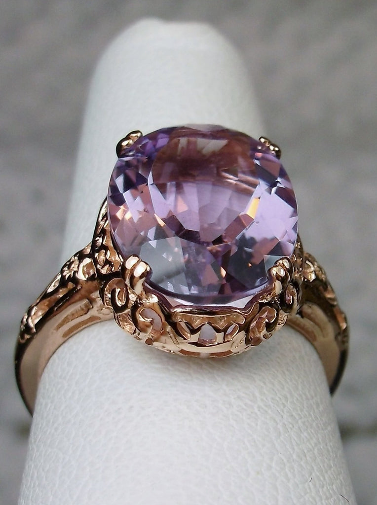 Front view of a Natural Purple Amethyst Rose Gold plated Sterling Silver Filigree Ring, Edward Design#70 on a ring holder