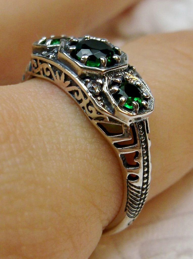 Art deco style ring with three green emeralds set in sterling silver filigree