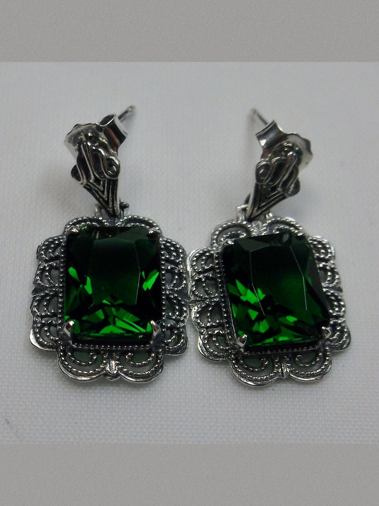 Rectangle Emerald Green Art Deco style earrings with fine lace filigree edging surrounding a lovely rectangle gemstone, and with fine Art Deco style ear post closures