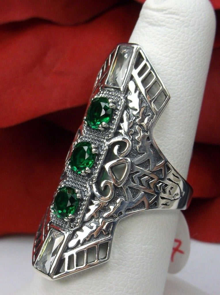 Green Emerald Art Deco Ring, with three round stones and two baguette stones, intricate 1930s filigree adorns the ring and the band