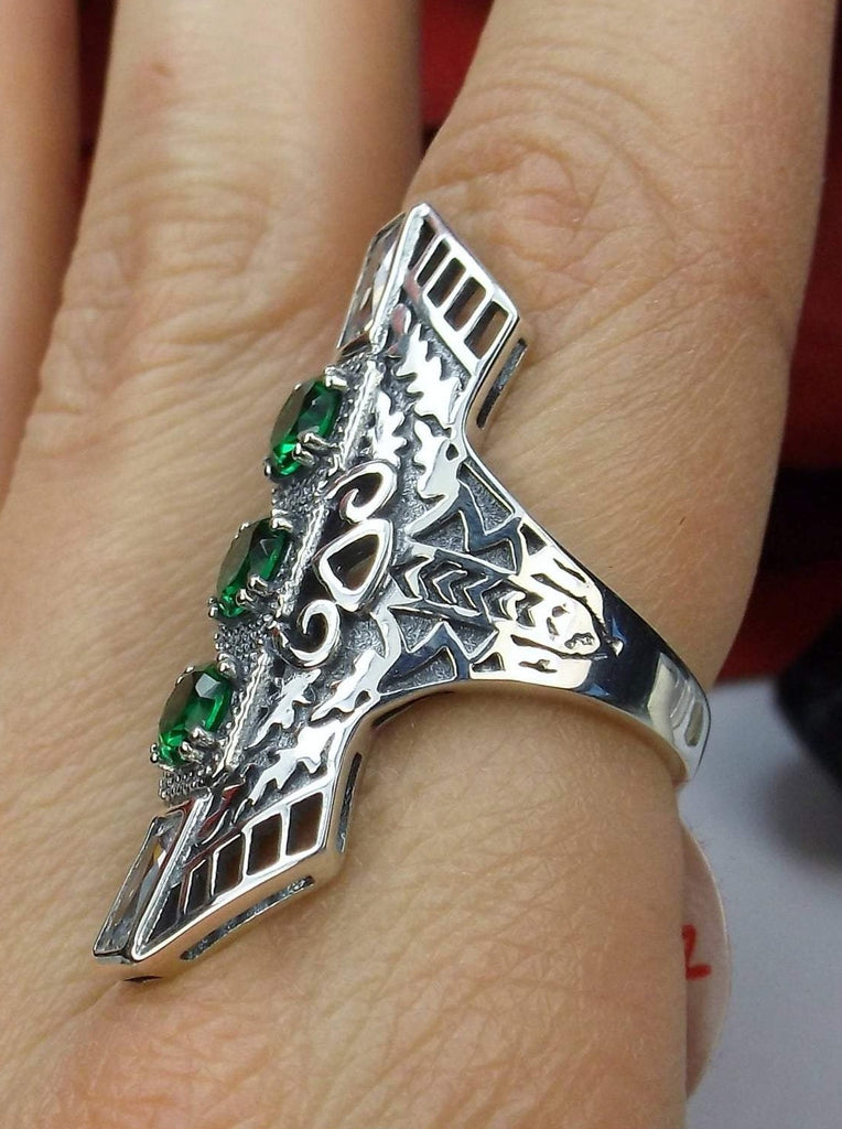 Green Emerald Art Deco Ring, with three round stones and two baguette stones, intricate 1930s filigree adorns the ring and the band