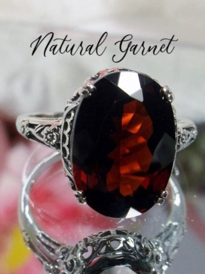 Natural Garnet Ring,  6.9 carat oval faceted natural gemstone, Sterling Silver floral filigree, Edward design #D70, offset front view on mirror surface