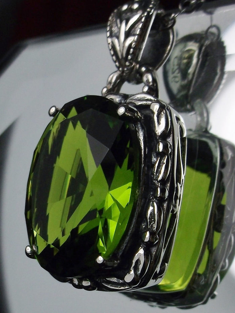 Green Peridot Pendant, oval green peridot gemstone surrounded by sterling silver leaf accent detail, creating a charming Art Nouveau pendant