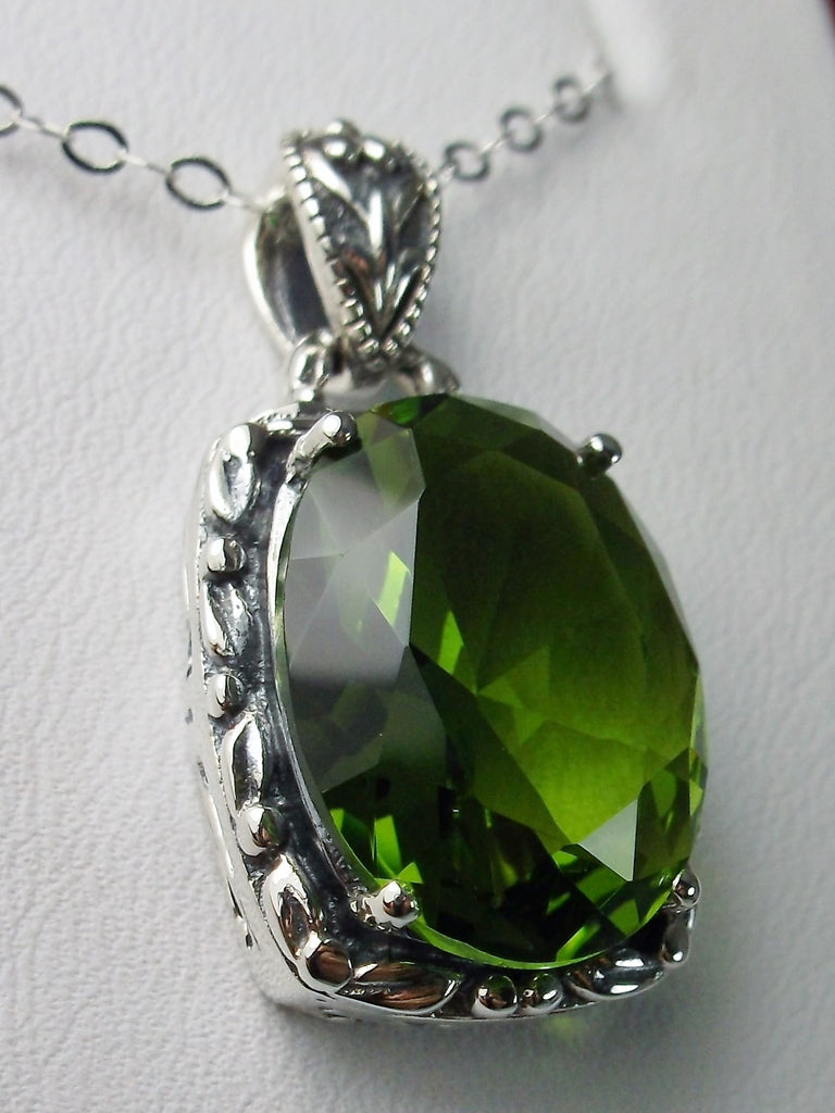 Green Peridot Pendant, Leaf Accent Pendant, oval faceted gemstone surrounded by sterling silver leaf accent detail, creating a charming Art Nouveau pendant, Sterling silver Filigree, Silver Embrace Jewelry P120