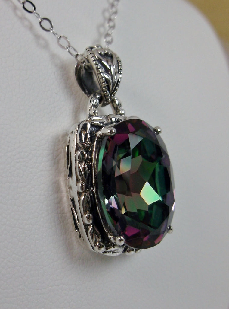 Mystic Topaz Pendant, oval mystic topaz gemstone surrounded by sterling silver leaf accent detail, creating a charming Art Nouveau pendant
