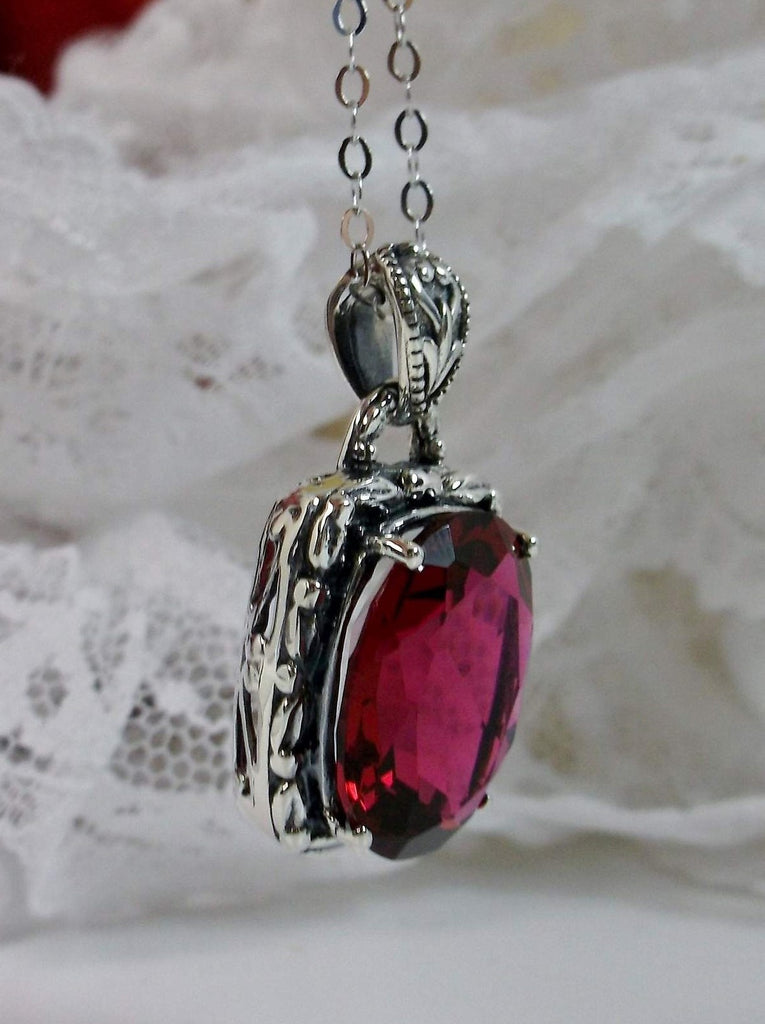 Red Ruby Pendant, Leaf Accent Pendant, oval faceted gemstone surrounded by sterling silver leaf accent detail, creating a charming Art Nouveau pendant, Sterling silver Filigree, Silver Embrace Jewelry P120