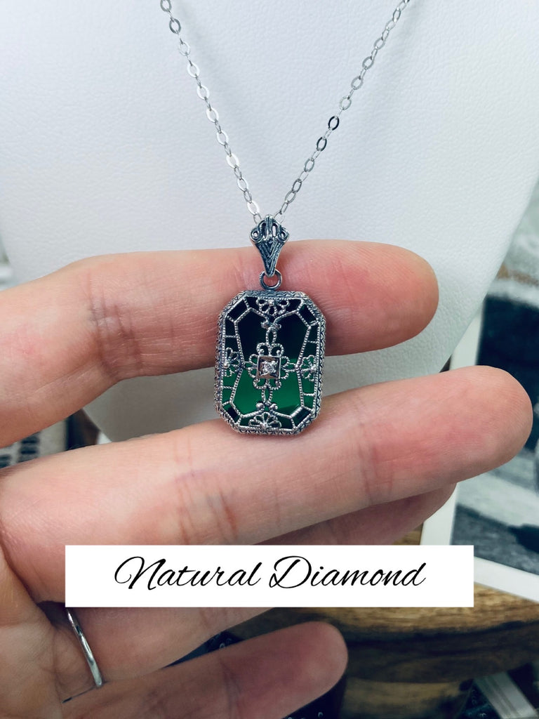 Emerald Green Glass pendant with a Diamond gem inset in the center, sterling silver filigree edging and across the glass face in window pane style