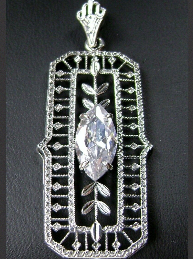 White CZ art deco pendant, center stone is marquise cut white CZ, delicate floral filigree surrounds the entire pendant and there are leaf accents above and below the center gemstone, Silver Embrace Jewelry