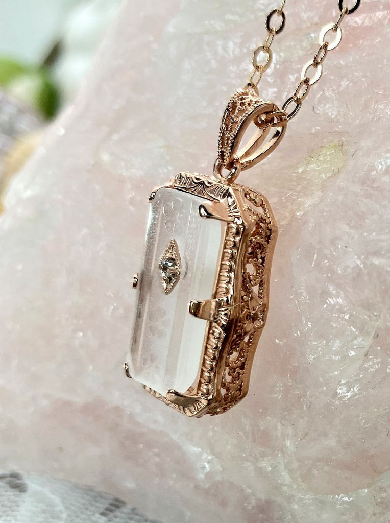 White Camphor Glass pendant, with rose gold filigree edging with three prongs, etched floral detail on the face of the glass and a CZ accent gem, Silver Embrace Jewelry
