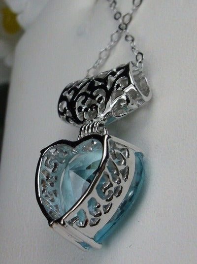 Heart shaped sky blue aquamarine pendant with sterling silver filigree detail, Silver Embrace Jewelry
