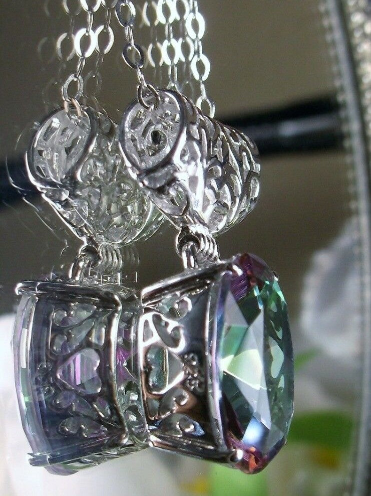 mystic rainbow topaz stone pendant with art deco sterling silver filigree a wide bail holds the swiveling oval stone, Silver Embrace Jewelry