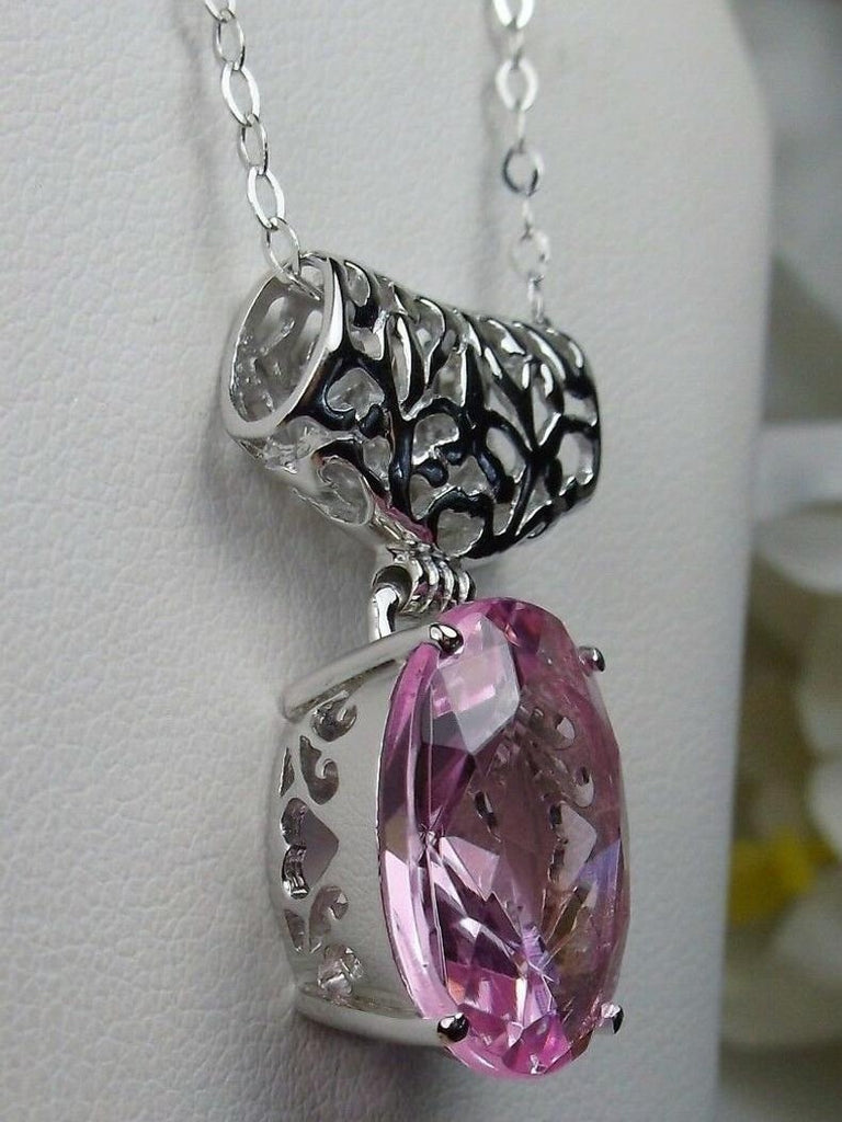 Pink oval stone pendant with art deco sterling silver filigree a wide bail holds the swiveling oval stone, Silver Embrace Jewelry