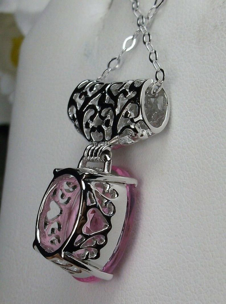 Pink oval stone pendant with art deco sterling silver filigree a wide bail holds the swiveling oval stone, Silver Embrace Jewelry
