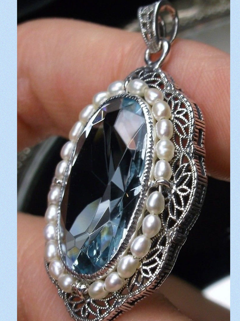 aquamarine pendant with large sky blue oval gemstone surrounded by seed pearls and antique floral filigree, Silver Embrace Jewelry