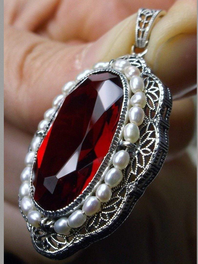 red ruby pendant with large deep red oval gemstone surrounded by seed pearls and antique floral filigree, Silver Embrace Jewelry