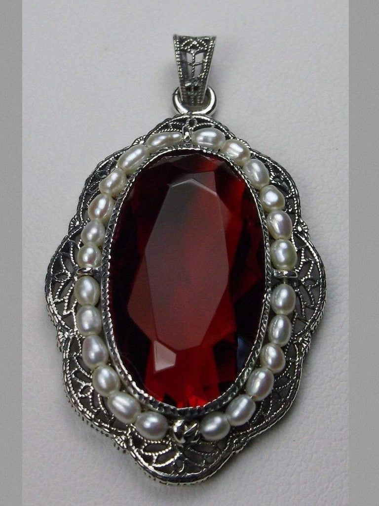 red ruby pendant with large deep red oval gemstone surrounded by seed pearls and antique floral filigree, Silver Embrace Jewelry