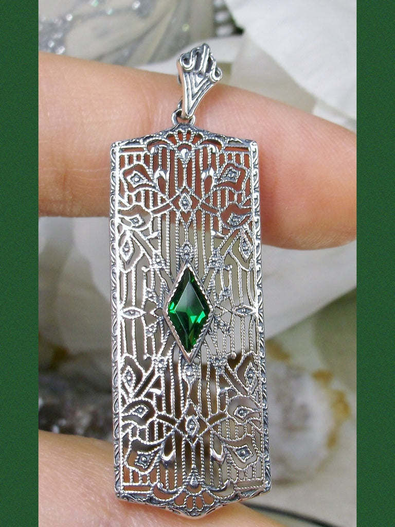 Rectangle Art Deco style pendant with fine lace filigree and a diamond shaped emerald green gemstone in the center of the delicate filigree, Silver Embrace Jewelry
