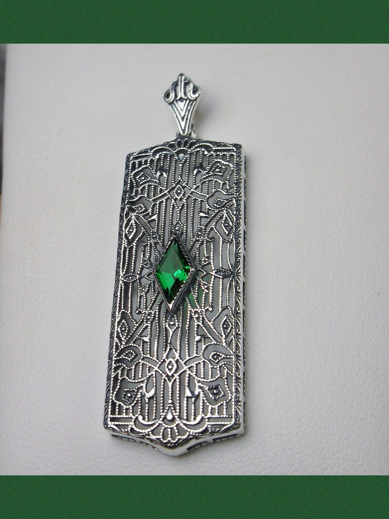 Rectangle Art Deco style pendant with fine lace filigree and a diamond shaped emerald green gemstone in the center of the delicate filigree, Silver Embrace Jewelry